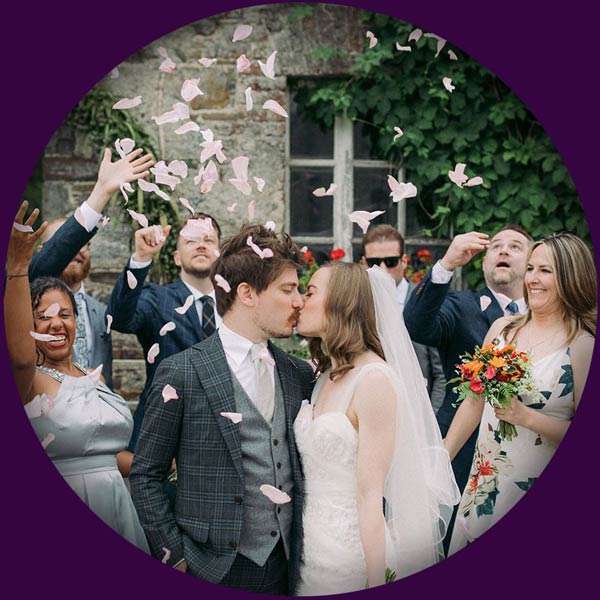 Ealish Whillock Humanist Celebrant guest throwing confetti over the bride and groom heads who have just been married