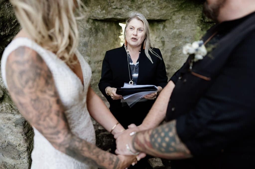 Humanist celebrant Ealish Whillock conducting an elopement ceremony in the ruins of a castle in Dingle, Co. Kerry